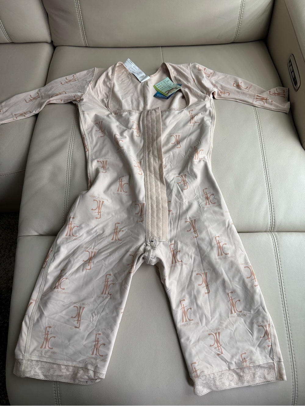 Light Beige Full-Body Shaping Bodysuit with Subtle Monogram Print